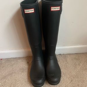 Tall black hunter boots